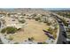 Community park aerial view showcasing a playground with sunshade amidst desert landscaping and mountains at 18508 W Galveston St, Goodyear, AZ 85338