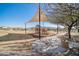 Community playground with covered play structure, wood chip base, and accessible concrete path at 18508 W Galveston St, Goodyear, AZ 85338