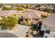 A bird's-eye view of a home with a driveway, landscaping, and neutral paint scheme at 19221 N Toya St, Maricopa, AZ 85138