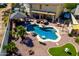 Expansive backyard featuring a custom pool, gazebo, outdoor kitchen, and desert landscaping at 19221 N Toya St, Maricopa, AZ 85138