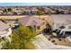 Aerial view of the house with an overhead shot of the lawn, the driveway, and a neighboring building at 19221 N Toya St, Maricopa, AZ 85138
