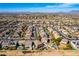 Areal picture of a suburban neighborhood showcasing uniform housing designs and desert surroundings at 19221 N Toya St, Maricopa, AZ 85138