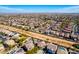 Wide aerial view of a neighborhood featuring uniform homes and desert landscaping at 19221 N Toya St, Maricopa, AZ 85138
