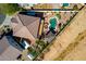 Overhead shot of a home with a backyard pool, gazebo, firepit, and desert landscaping at 19221 N Toya St, Maricopa, AZ 85138