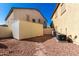 Low maintenance backyard featuring gravel, stone pavers, storage and AC units at 19221 N Toya St, Maricopa, AZ 85138