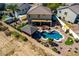 Bird's eye view of landscaped backyard showcasing pool with desert plantings, gazebo and patio seating at 19221 N Toya St, Maricopa, AZ 85138