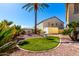 Landscaped backyard with green grass and vibrant plants, creating a serene and picturesque outdoor oasis at 19221 N Toya St, Maricopa, AZ 85138