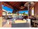 Inviting covered patio with lounge seating, a ceiling fan, and a view of the sparkling swimming pool at 19221 N Toya St, Maricopa, AZ 85138