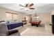 Spacious upstairs game room with a billiard table, seating, and natural light at 19221 N Toya St, Maricopa, AZ 85138