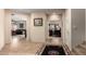 Hallway featuring neutral walls, tile flooring, and access to multiple rooms at 19221 N Toya St, Maricopa, AZ 85138
