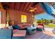 Outdoor covered pavilion featuring comfortable seating and lush backyard landscape at 19221 N Toya St, Maricopa, AZ 85138