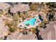 An aerial view showcasing the pool and spa area, all surrounded by well-maintained landscaping at 19700 N 76Th St # 1080, Scottsdale, AZ 85255
