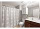 Cozy bathroom with a vanity, toilet, and shower with patterned curtain at 19700 N 76Th St # 1080, Scottsdale, AZ 85255