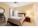 Comfortable bedroom featuring a ceiling fan, bedside tables, and large closet at 19700 N 76Th St # 1080, Scottsdale, AZ 85255
