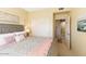Bright bedroom with a ceiling fan and sliding closet doors at 19700 N 76Th St # 1080, Scottsdale, AZ 85255