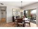 Dining area with a round table and access to the outdoor patio with seating at 19700 N 76Th St # 1080, Scottsdale, AZ 85255