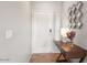 Bright entryway featuring tiled flooring, a decorative mirror, and an accent table at 19700 N 76Th St # 1080, Scottsdale, AZ 85255