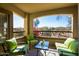 Relaxing covered patio with comfortable seating and tranquil views at 19700 N 76Th St # 1080, Scottsdale, AZ 85255
