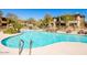 Enjoy the community pool with a beautiful waterfall feature and comfortable lounge chairs at 19700 N 76Th St # 1080, Scottsdale, AZ 85255