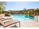 Community pool area featuring a shimmering pool, lounge chairs and trees at 19700 N 76Th St # 1080, Scottsdale, AZ 85255