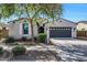 Charming single-story home featuring a two-car garage and desert landscaping at 20159 E Rosa Rd, Queen Creek, AZ 85142