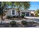 Charming single-story home with a well-kept front yard and a two car garage at 20159 E Rosa Rd, Queen Creek, AZ 85142