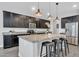 Stylish kitchen island featuring a breakfast bar and pendant lighting at 20159 E Rosa Rd, Queen Creek, AZ 85142