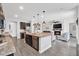 Open-concept kitchen with an island and stainless steel appliances at 20159 E Rosa Rd, Queen Creek, AZ 85142