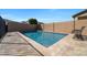 Beautiful private backyard pool featuring tiled deck, block wall fence, and outdoor seating at 20159 E Rosa Rd, Queen Creek, AZ 85142