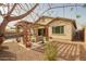 Inviting backyard featuring a covered patio with lounge seating and a glimpse of the refreshing pool at 20325 E Hummingbird Dr, Queen Creek, AZ 85142