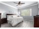Cozy bedroom with wood floors, a ceiling fan, and neutral decor at 20325 E Hummingbird Dr, Queen Creek, AZ 85142