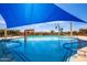 Enjoy the community pool, complete with playful water features and ample lounge space at 20325 E Hummingbird Dr, Queen Creek, AZ 85142