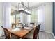 Dining area with a wooden table, seating for six, and sliding glass door at 20325 E Hummingbird Dr, Queen Creek, AZ 85142