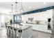 Modern kitchen with white cabinetry, granite countertops, stainless appliances, and an open layout at 20325 E Hummingbird Dr, Queen Creek, AZ 85142