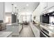 Bright, open kitchen featuring stainless steel appliances, granite counters, and a kitchen island at 20325 E Hummingbird Dr, Queen Creek, AZ 85142