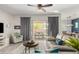 Bright living room with patio access, neutral walls, wooden floors and comfortable seating at 20325 E Hummingbird Dr, Queen Creek, AZ 85142