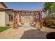Comfortable outdoor seating under a wooden pergola with a paver patio offers relaxation and shade at 20325 E Hummingbird Dr, Queen Creek, AZ 85142