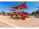 A vibrant community playground with slides and climbing structures for active fun in a secure environment at 20325 E Hummingbird Dr, Queen Creek, AZ 85142