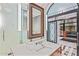 Lavish bathroom with a frosted glass enclosed shower and sleek modern fixtures at 20715 N 103Rd Pl, Scottsdale, AZ 85255