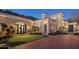 Inviting front yard with a mini golf course and a beautiful Mediterranean-style home at 20715 N 103Rd Pl, Scottsdale, AZ 85255