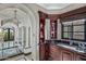 A grand hallway featuring arched openings leads to the steam room; showcasing classic design and marble flooring throughout at 20715 N 103Rd Pl, Scottsdale, AZ 85255