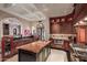 Gourmet kitchen featuring custom cabinetry, island prep sink, and stainless steel appliances with room for a cooktop and breakfast bar at 20715 N 103Rd Pl, Scottsdale, AZ 85255