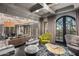 Modern living room with sleek furniture and scenic views through large windows at 20715 N 103Rd Pl, Scottsdale, AZ 85255