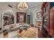 Warm living room featuring a fireplace, custom built-ins, and hardwood floors at 20715 N 103Rd Pl, Scottsdale, AZ 85255