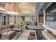 Open-concept living room with modern fireplace and comfortable seating at 20715 N 103Rd Pl, Scottsdale, AZ 85255