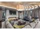 Spacious living room with vaulted ceilings, modern fireplace, and large windows at 20715 N 103Rd Pl, Scottsdale, AZ 85255