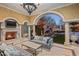 Serene covered outdoor living space overlooking a lush backyard and pool at 20715 N 103Rd Pl, Scottsdale, AZ 85255