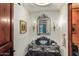 Chic powder room featuring a custom vanity, decorative mirror, and elegant sconces at 20715 N 103Rd Pl, Scottsdale, AZ 85255