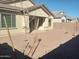 Low maintenance backyard featuring gravel landscaping, a covered patio, and a block wall at 20951 E Via Del Sol St, Queen Creek, AZ 85142
