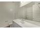 This is a bathroom featuring a single sink vanity with a built-in tub and shower at 20951 E Via Del Sol St, Queen Creek, AZ 85142